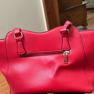Red leather handbag. Used a few times. Excellent condition.